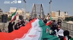 Iranians form human chains at bridges and power...