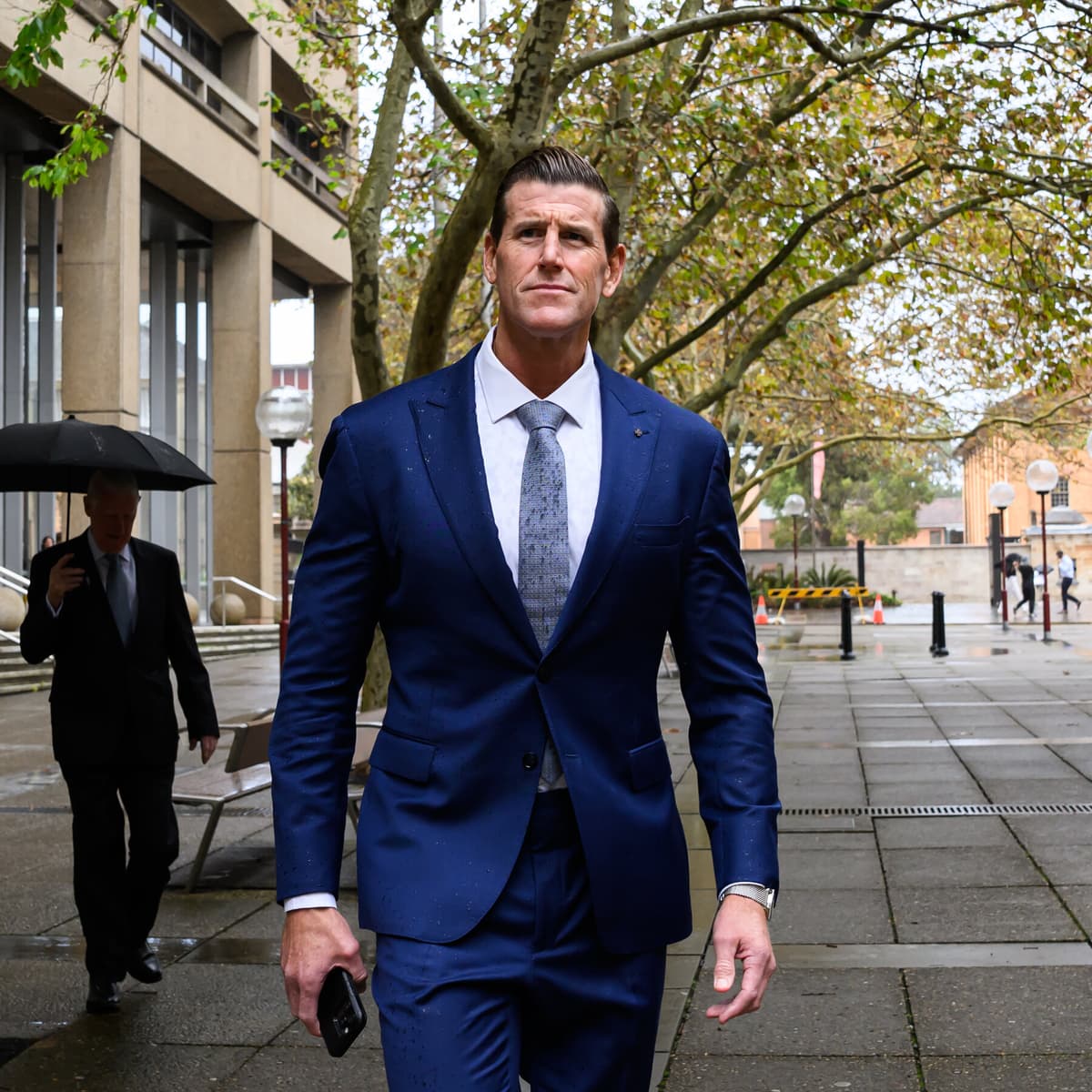 Australia Charges Ex-Soldier With War Crimes in...