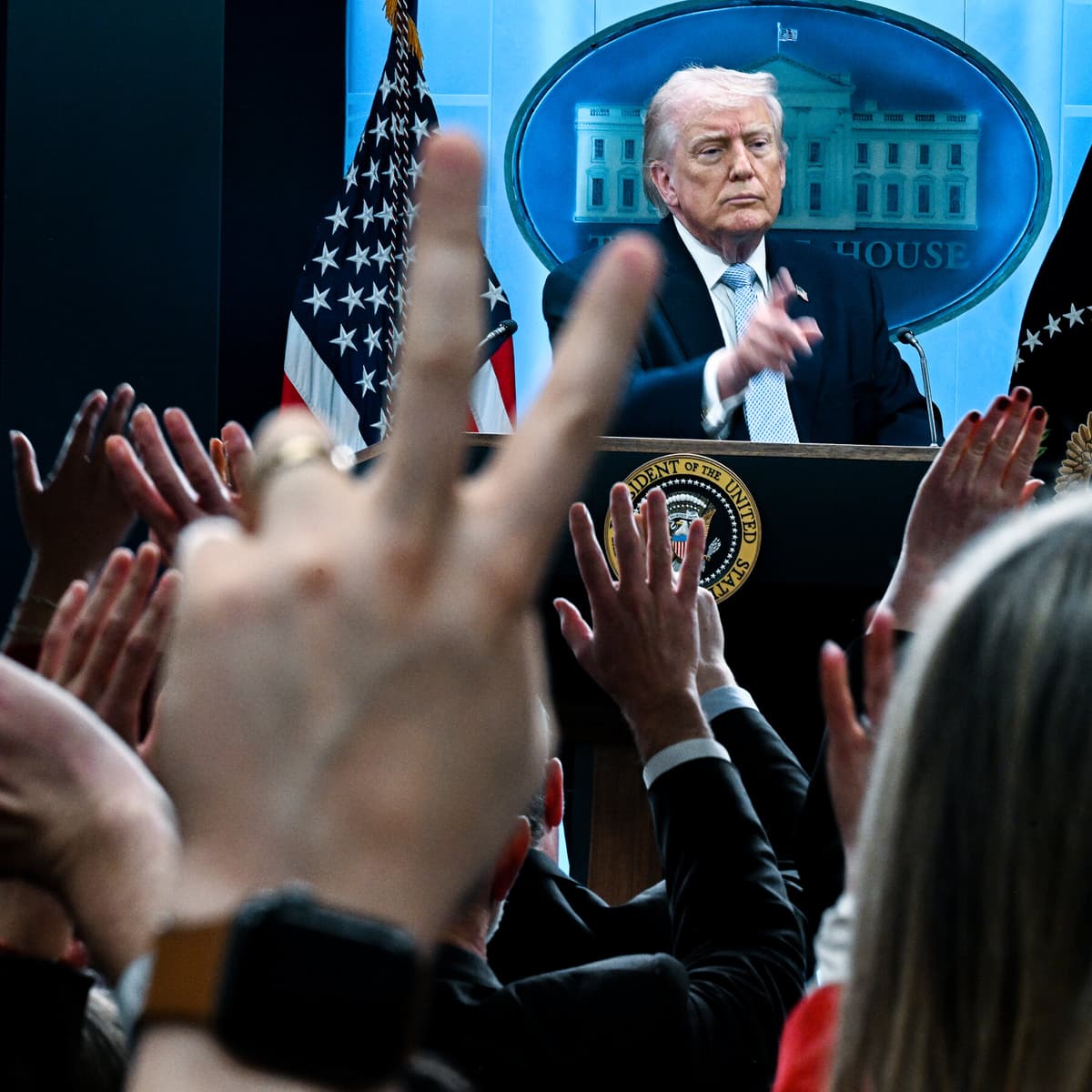 Trump Backs Down, but Questions Remain About...