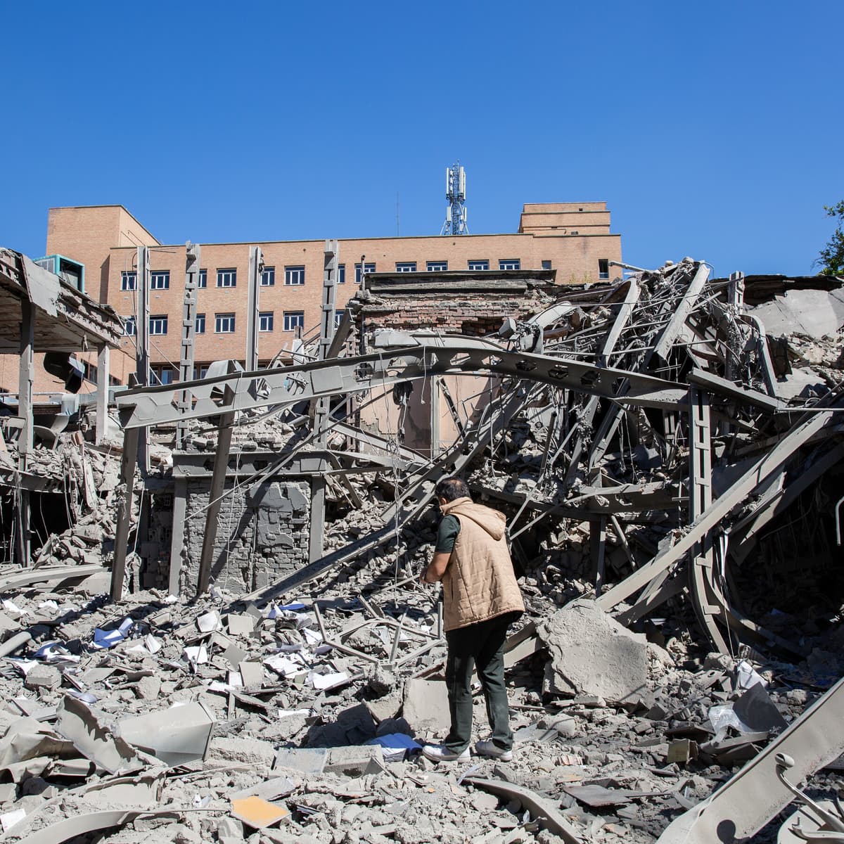 Iranians Voice Shock and Defiance in Face of...